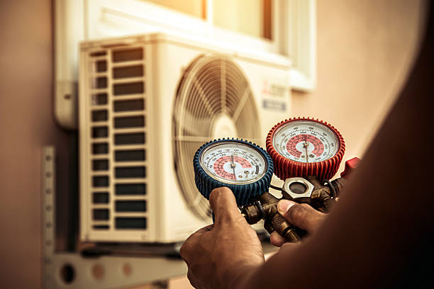 Professional Hvac technician working in Harveysburg, OH